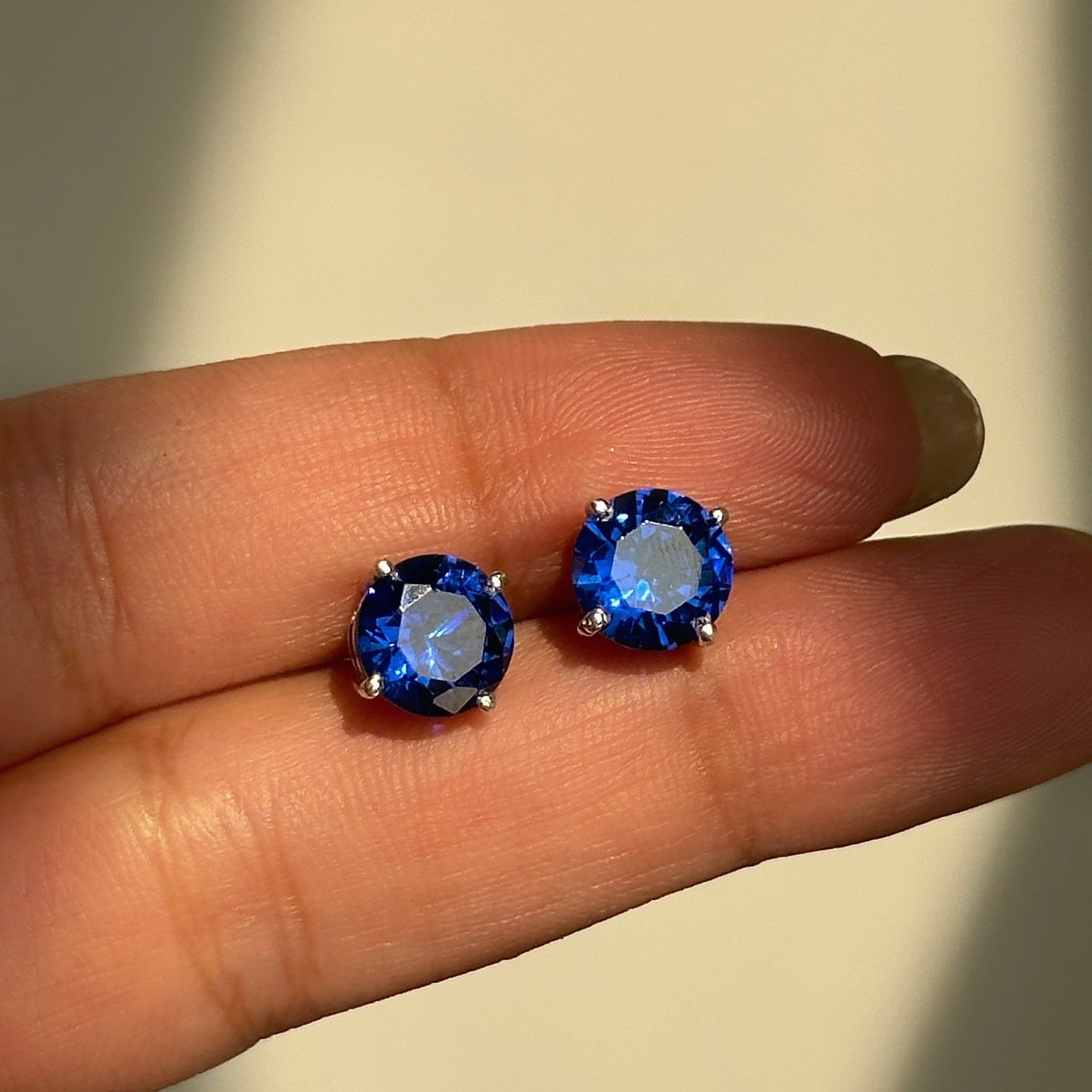 sapphire glow studs 8mm close-up — round blue stone detail