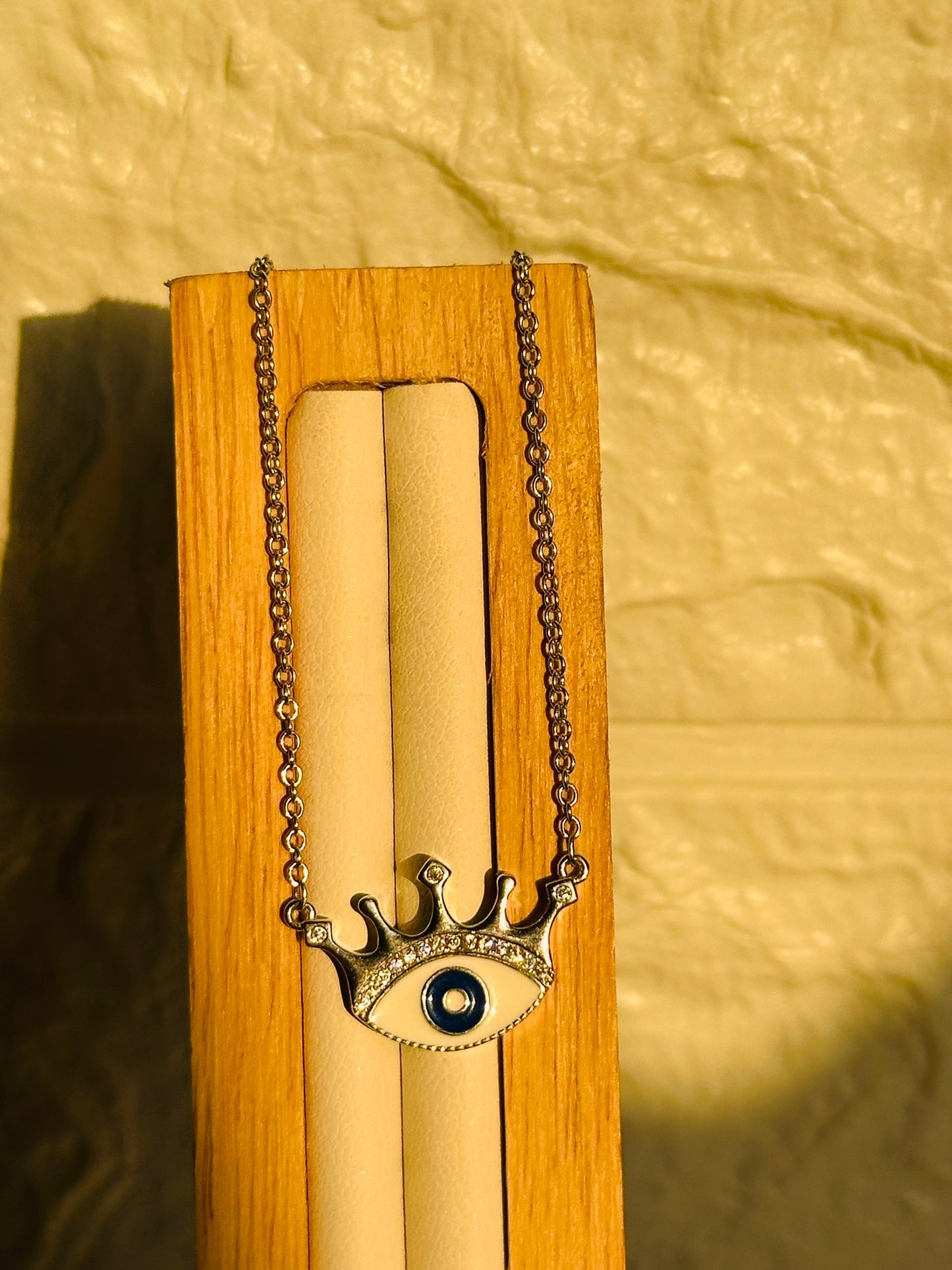 crowned evil eye neckpiece