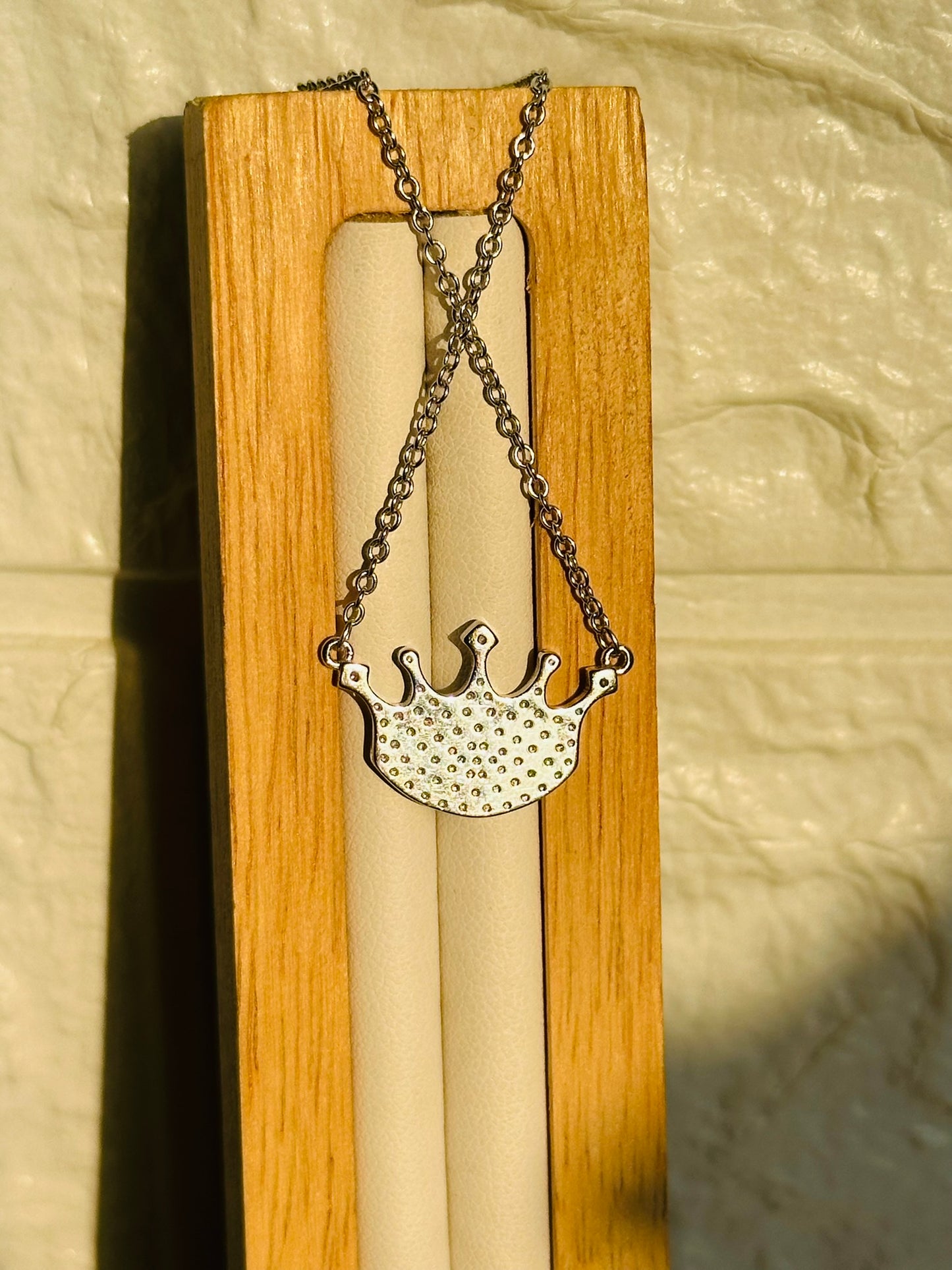 crowned evil eye neckpiece