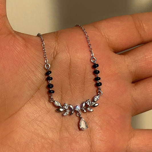 Gleam Drop Mangalsutra in 925 sterling silver with floral teardrop pendant and black beads, House of Binti
