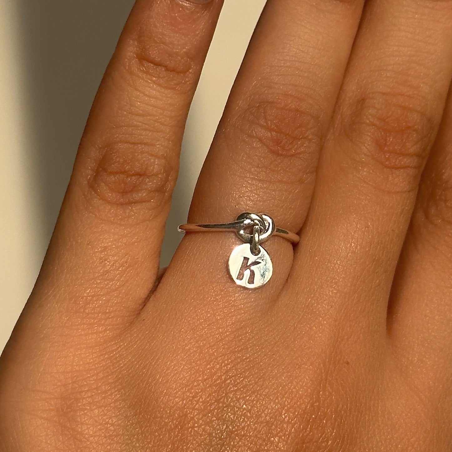 initial charm ring in 925 sterling silver with personalised dangling letter charm, house of binti