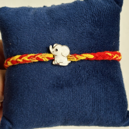 Baby Elephant Rakhi close-up — enamel baby elephant motif detail