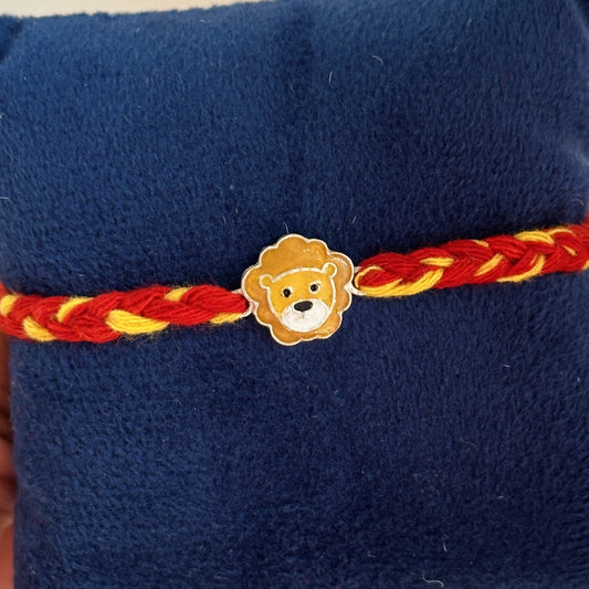 Little Lion Rakhi close-up — enamel lion motif detail