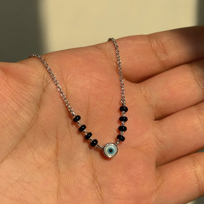 Evil Eye Essence Mangalsutra close-up — blue evil eye charm detail