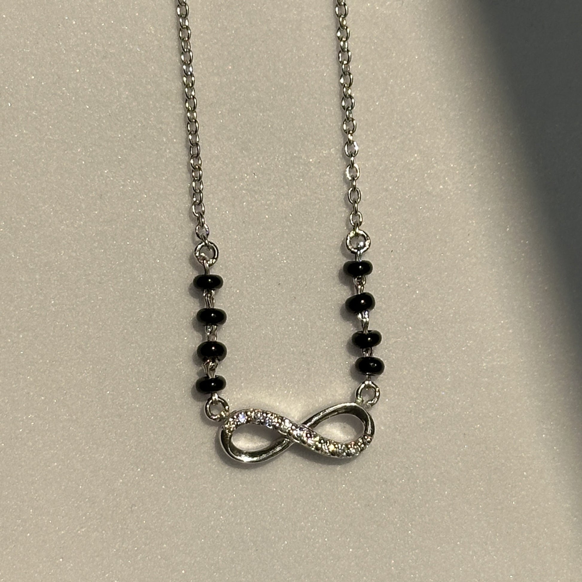 Infinity Grace Mangalsutra — infinity motif in 925 silver with black beads