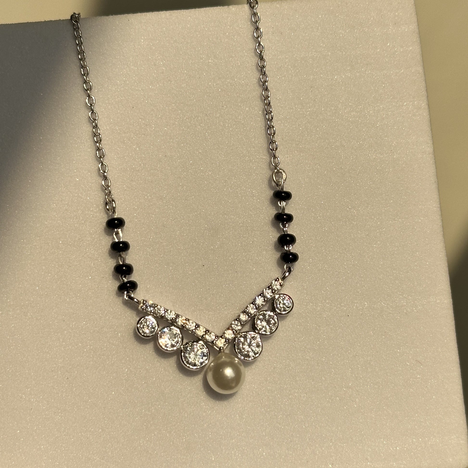 Royal Pearl Mangalsutra close-up — pearl and zircon motif detail