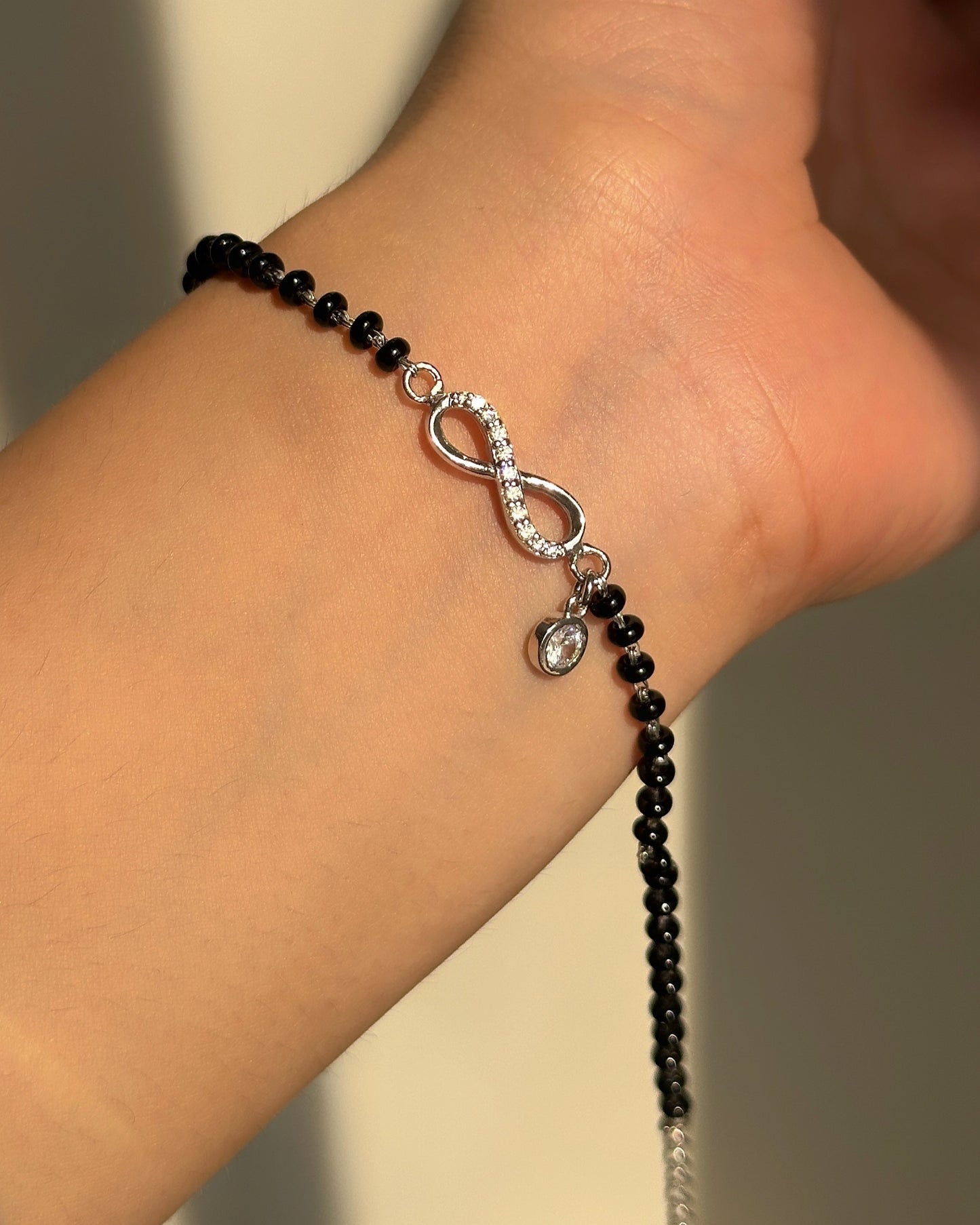 infinity drop hand mangalsutra — infinity motif with hanging zircon drop