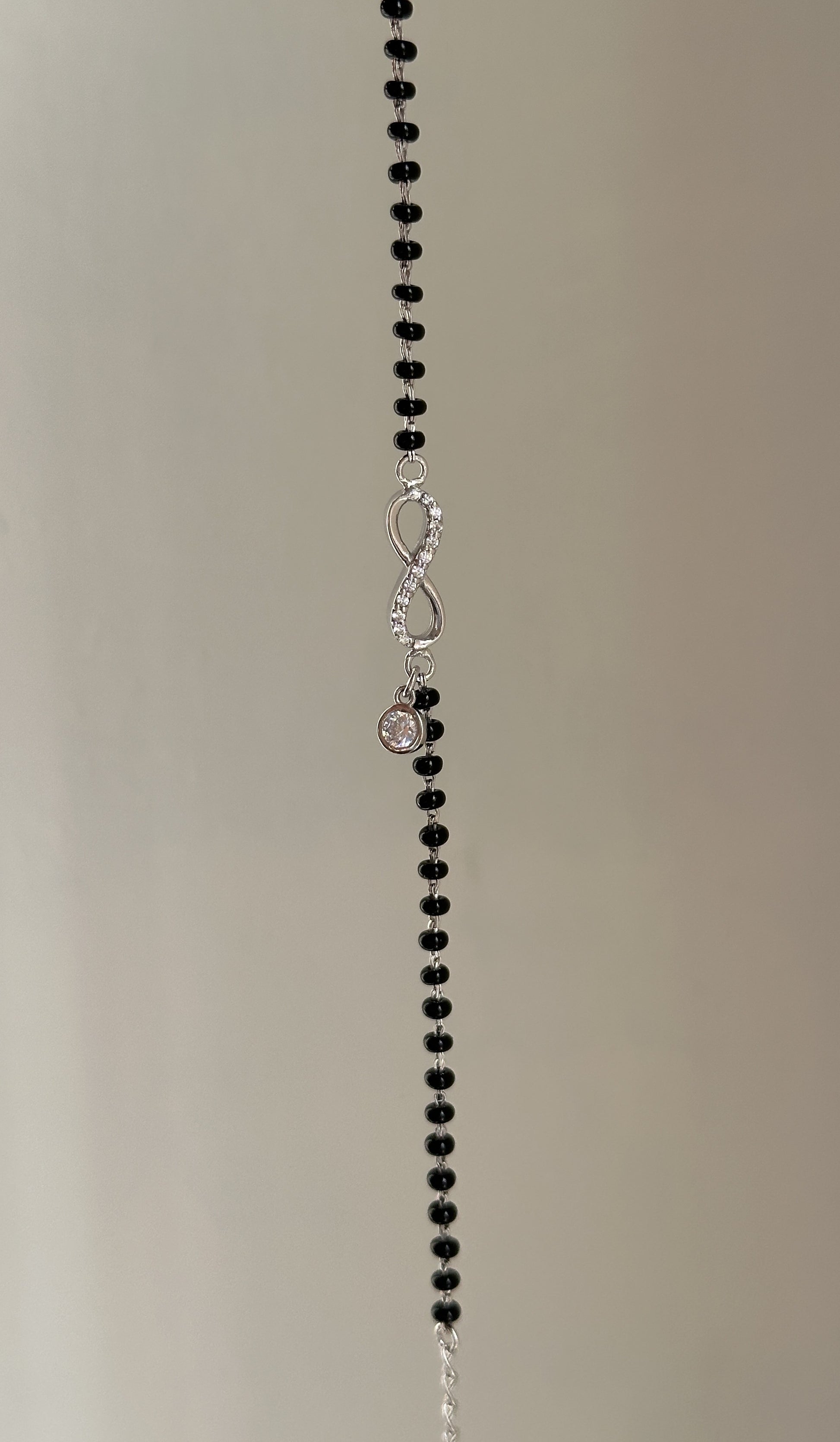 Infinity Drop Hand Mangalsutra close-up — hanging zircon charm detail