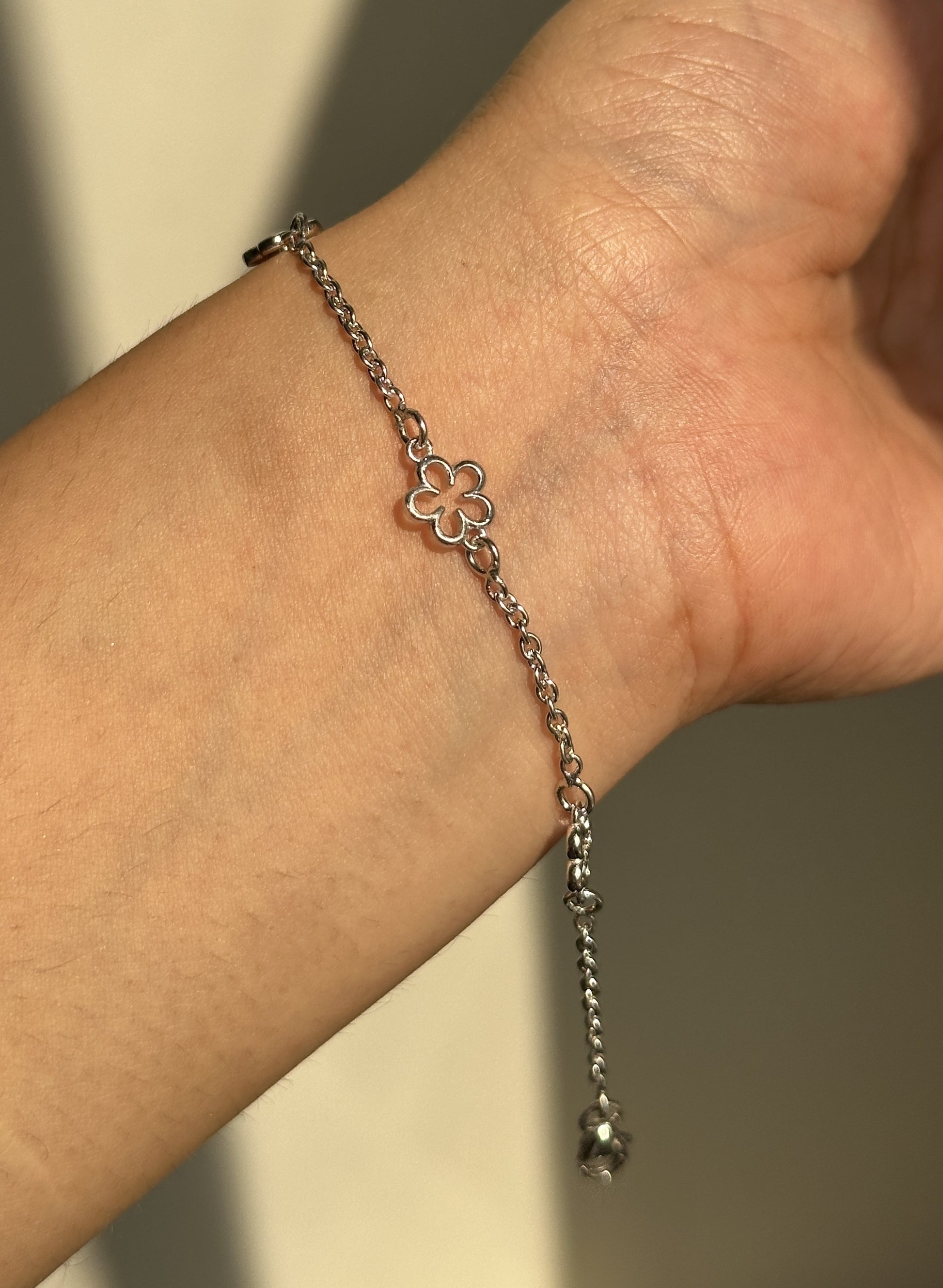 Little Flower Halo Bracelet close-up — silver open flower motif detail
