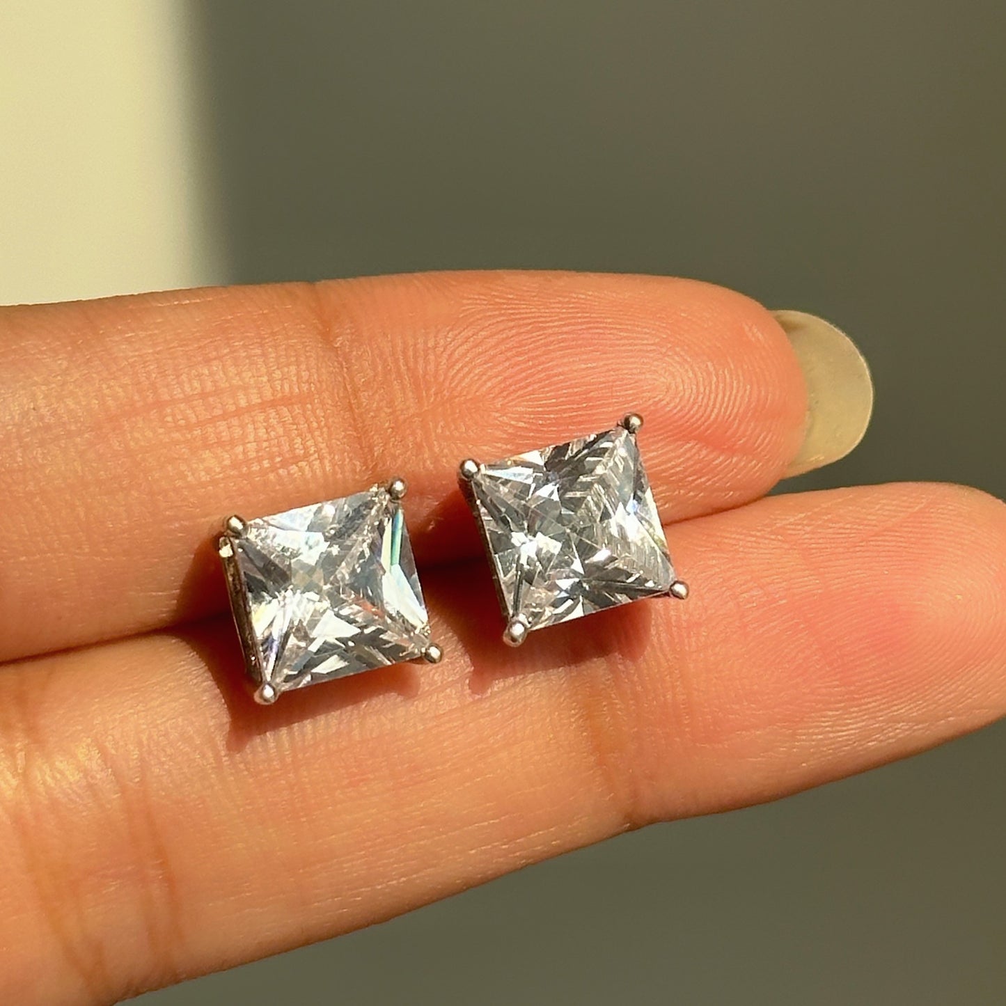 luna square studs close-up — white zircon square-cut stone detail