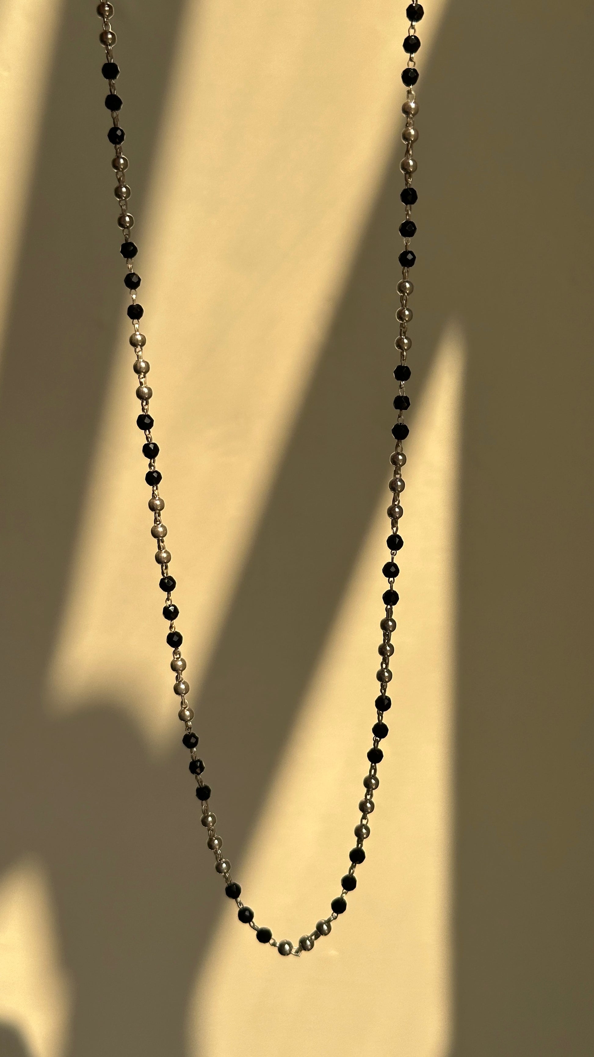 Classic Black Bead Chain close-up — alternating silver and black bead detail