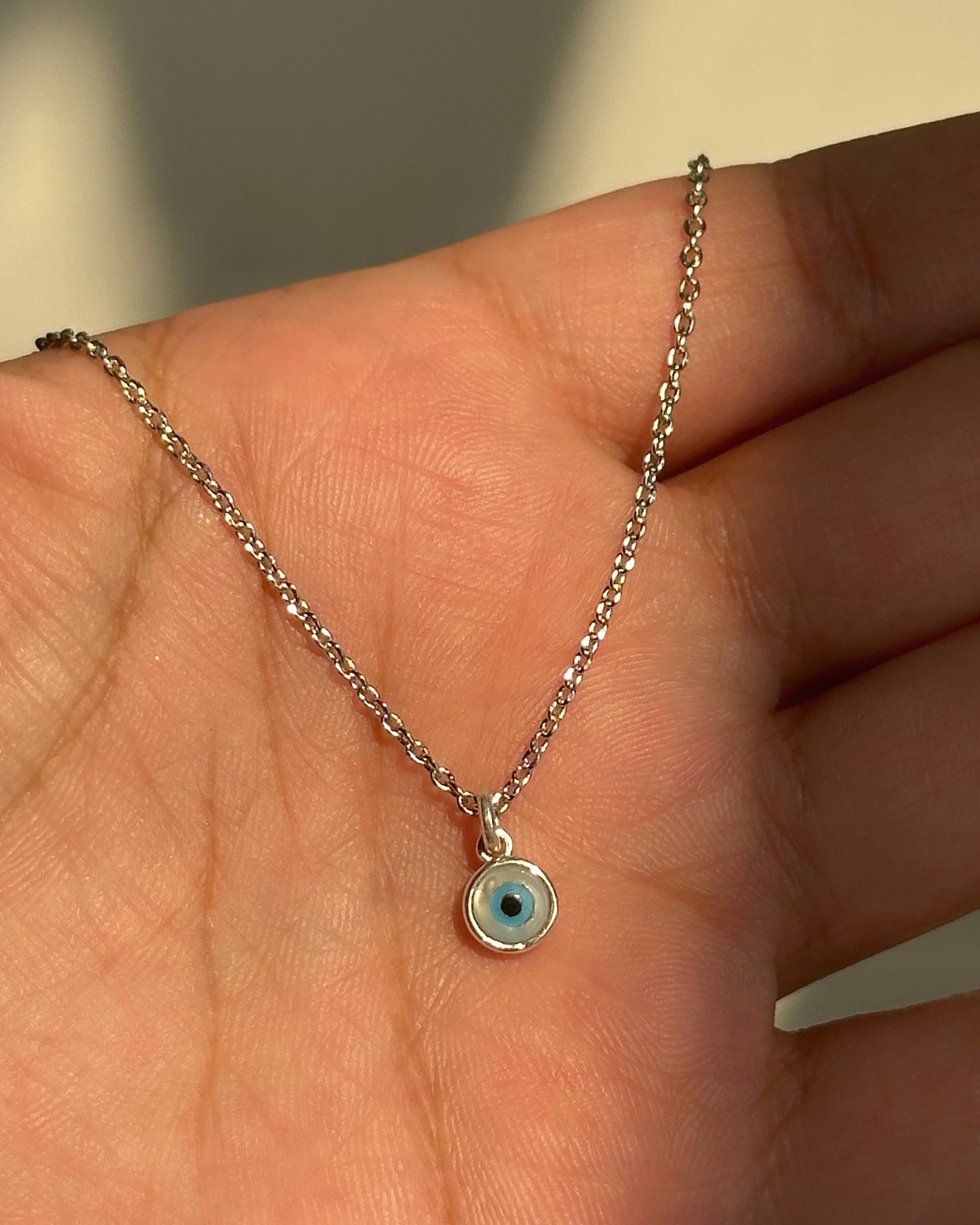 Small Evil Eye Neckpiece close-up — blue evil eye pendant detail