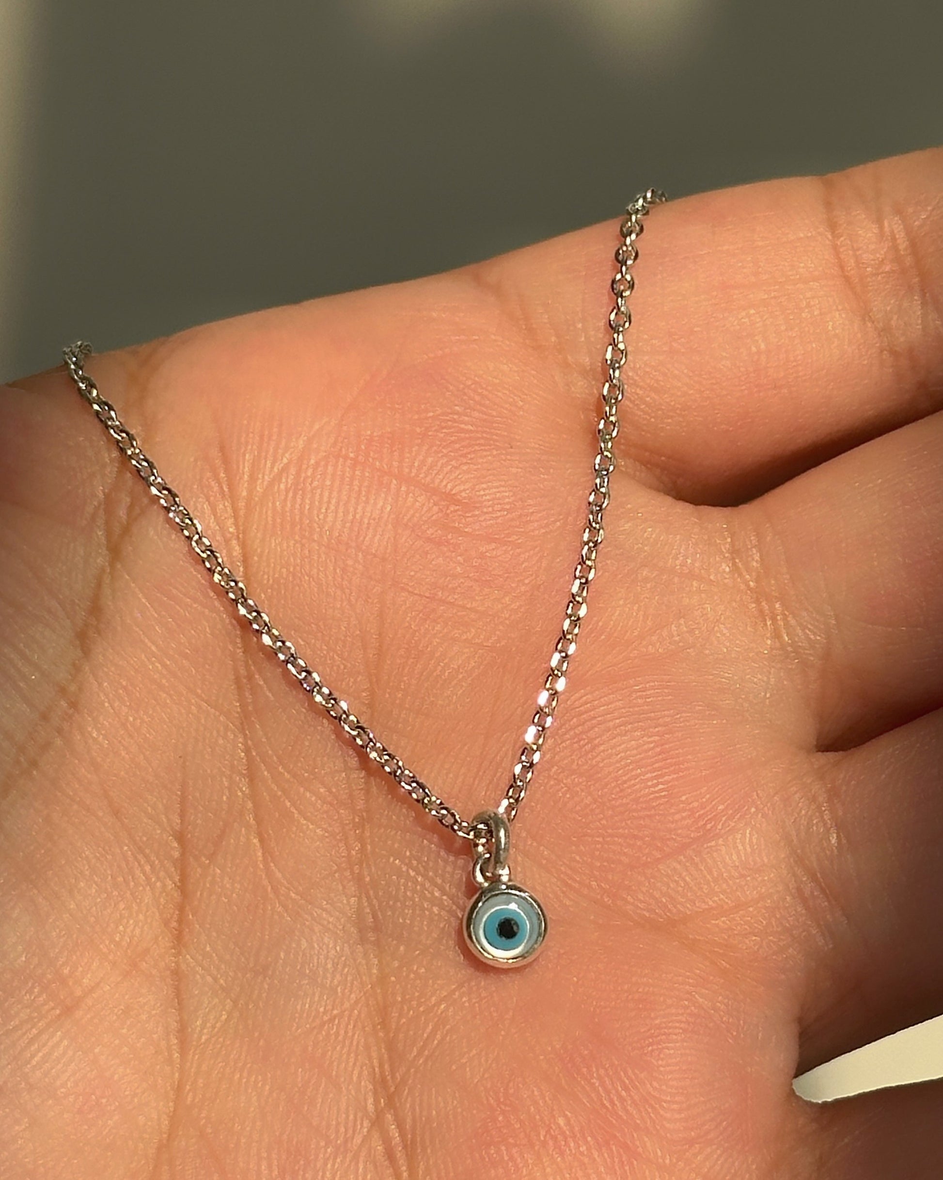 Tiny Evil Eye Neckpiece close-up — dainty blue evil eye pendant