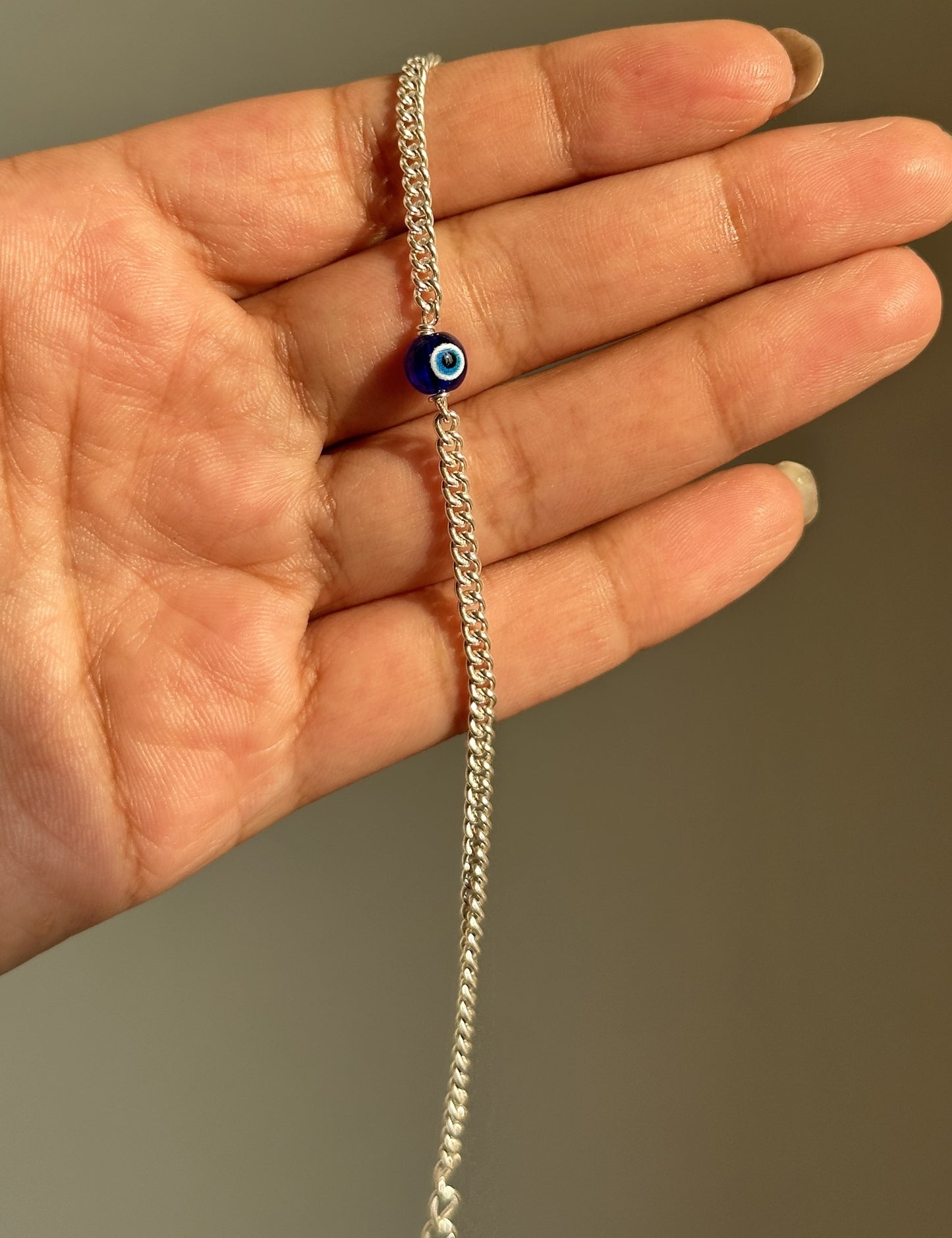 guardian evil eye bracelet close-up — round blue evil eye stone