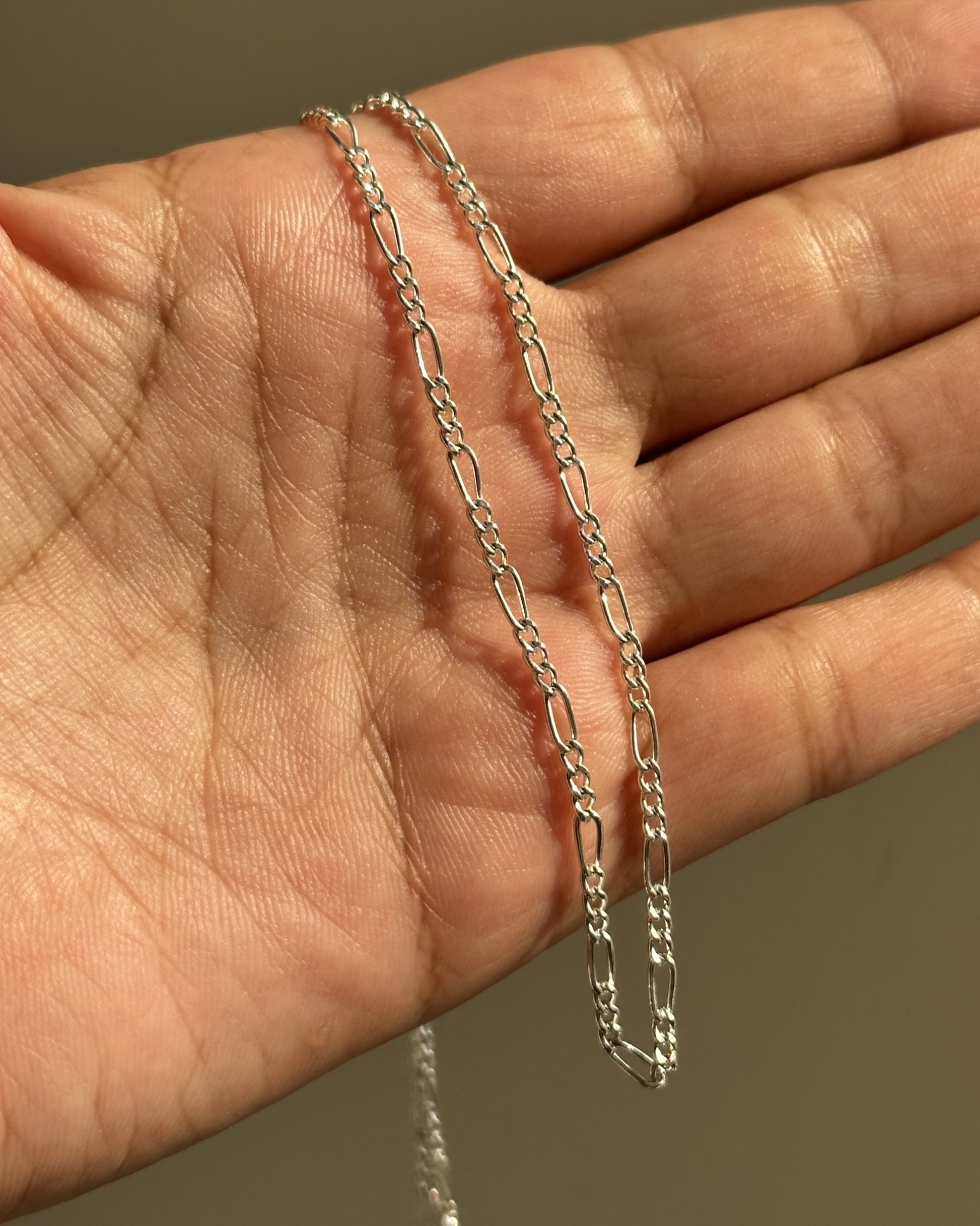 Mini Figaro Chain close-up — alternating Figaro link pattern detail